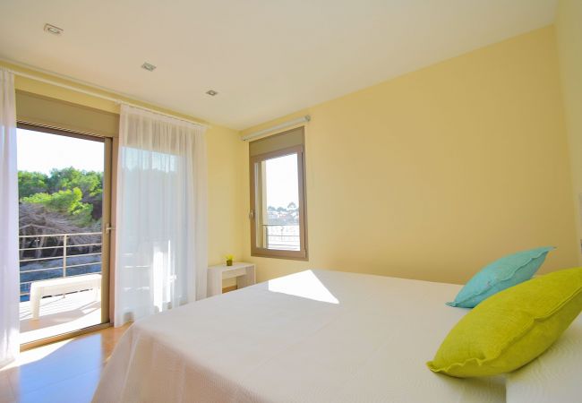 Dormitorio de la villa en Can Picafort Dormitorio de la villa en Can Picafort