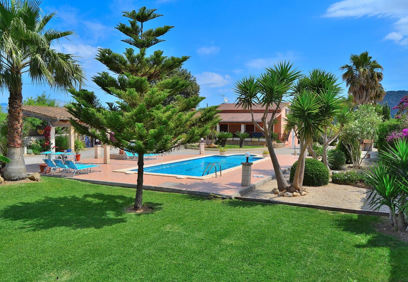 The villa has a large outdoor pool