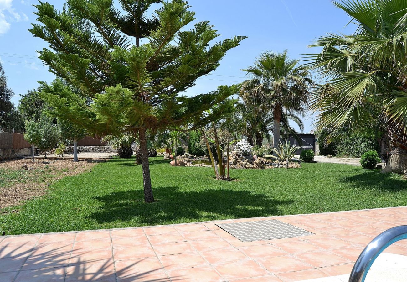 The villa has a large garden where there is a pool